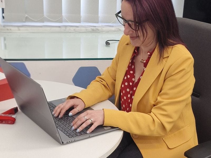 Alexia working at laptop